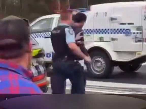Driver being arrested.